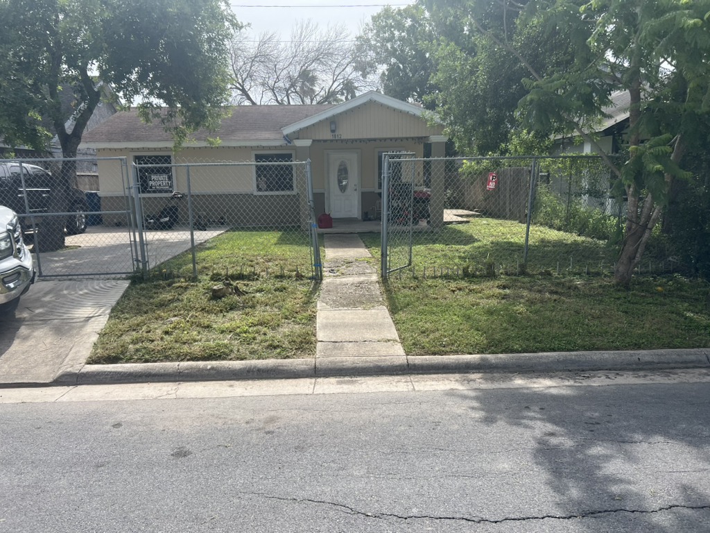 Professional lawn mowing service showing a precise striped finish in Central Texas.