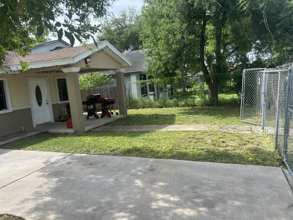 Finished overgrown cleanup, featuring a fresh mow and clean edges. (After image)