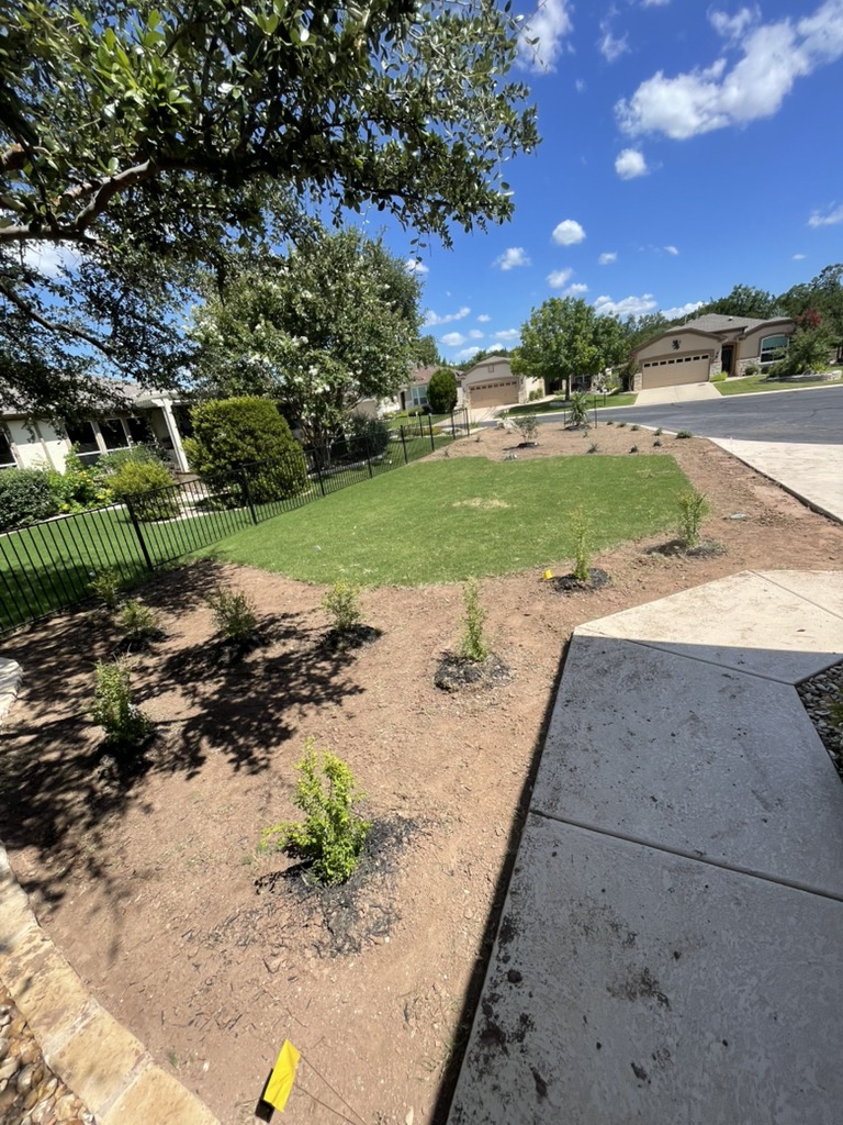 Front yard landscaping project including mulch refresh and expert bush trimming.