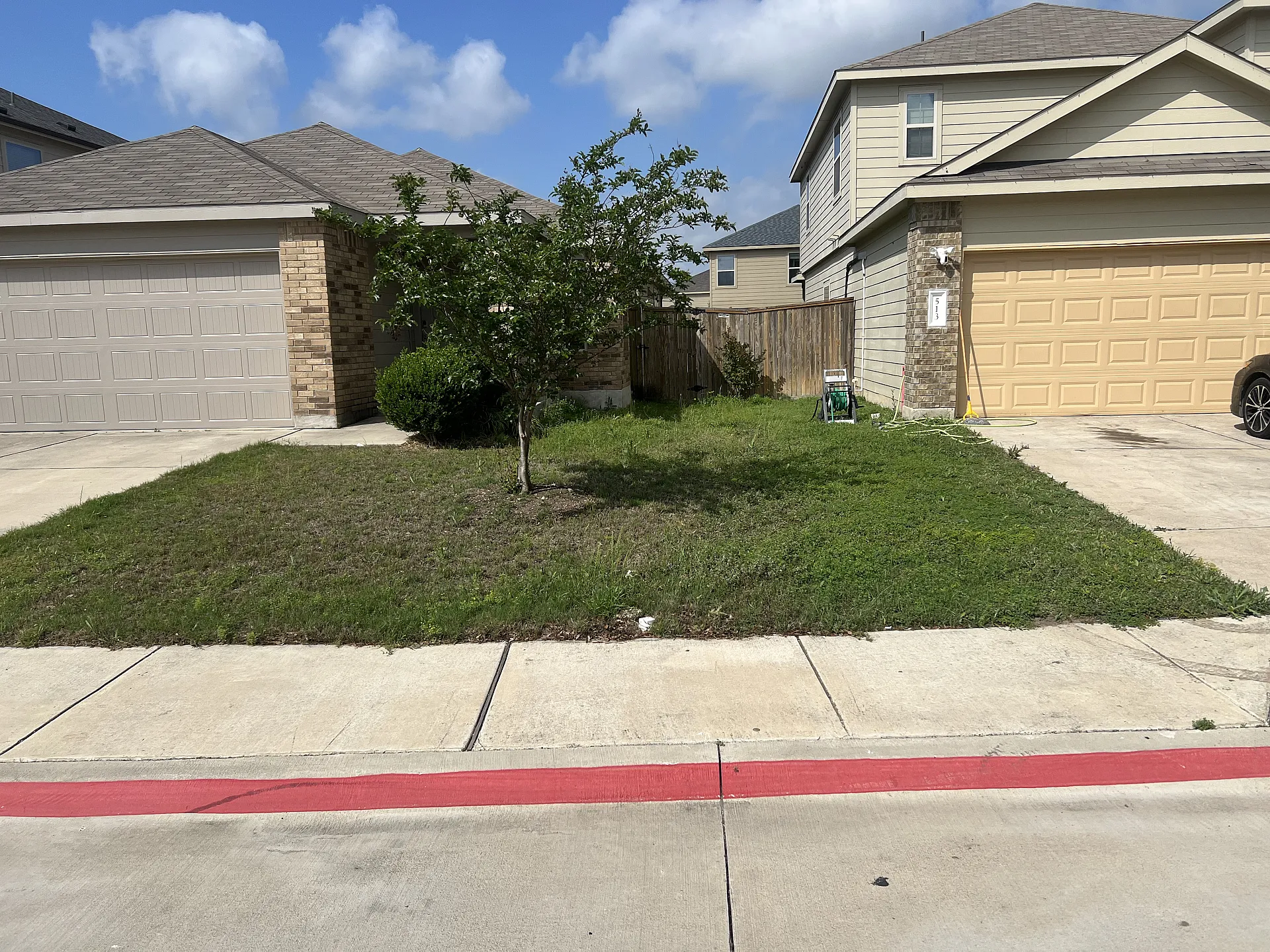 Residential lawn with fresh cut grass and clear edges.
