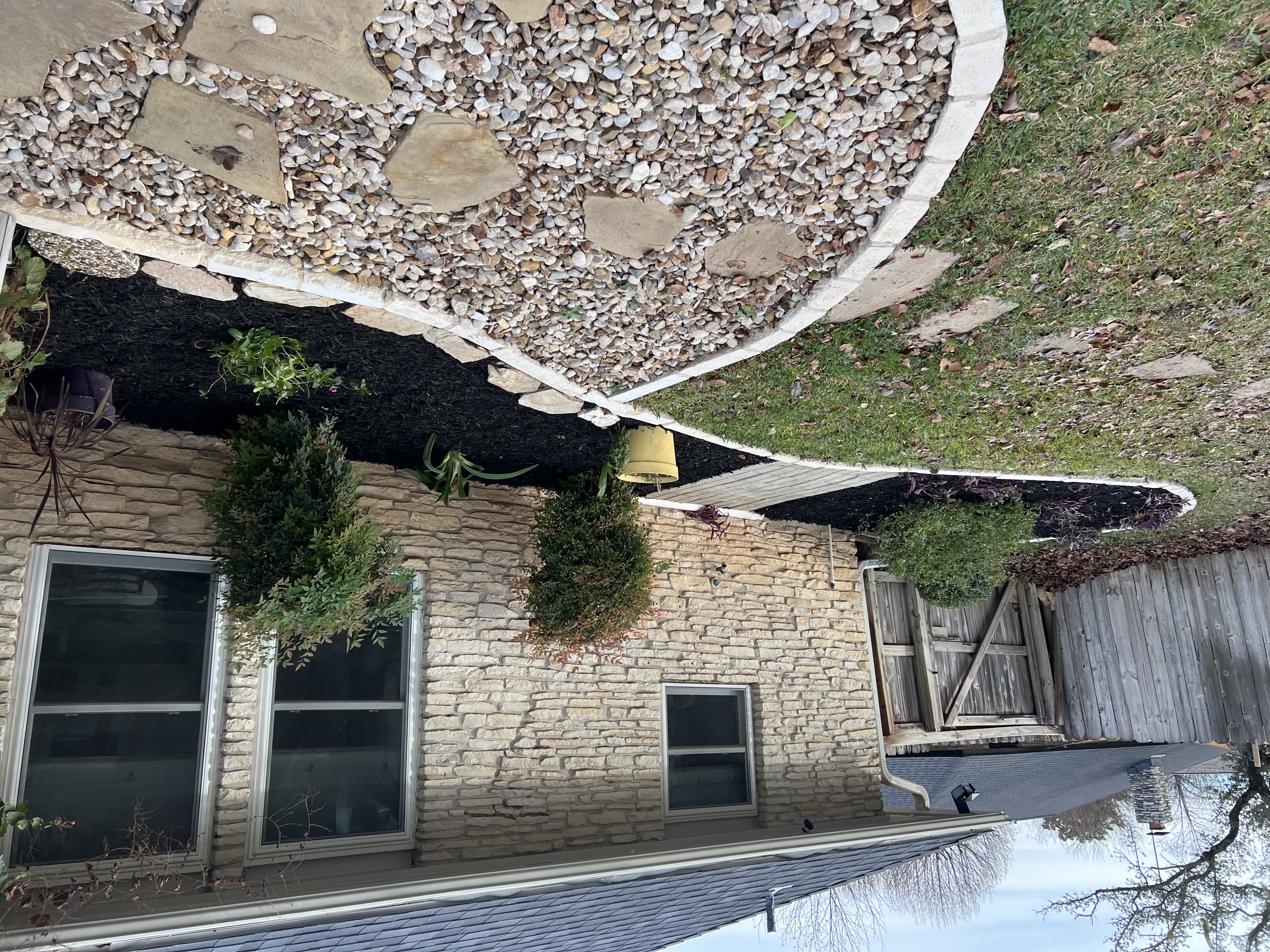 Completed front yard beds with a deep, fresh layer of mulch.